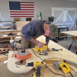 Climbing up on the workbench provided a better body position to cut out some of the letters