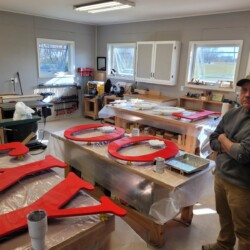 It was satisfying to see all the letters and components with their first coats of paint on the same day that we brought the raw plywood into the workshop