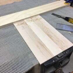 Cleaning up the top and bottom glue ups with a scraper.