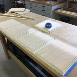 Four square sides, mitered on three edges. The fifth square is mitered on all four edges.