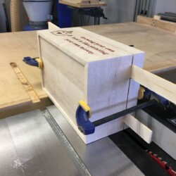 Shims and clamps stabilize the two sections for the final cut.