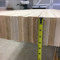 Based on an average density of 44 lb/ft3 for hard maple, the top alone should weigh about 175 pounds.
