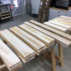 Rough parts cut for sizing and laminating. From left to right, four legs, two long rails, and five short rails.