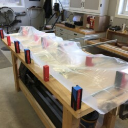 Heavy plastic protects bar clamps from glue squeeze out