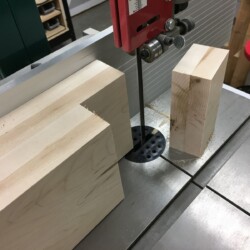 Using the bandsaw to make the cheek cuts for the leg tenons