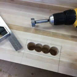 Combination square used to check depth of drilled holes