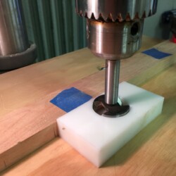 Setting up 35mm Forstner bit for drilling cup hinge mounting holes