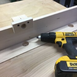 Shop made jig for drilling pilot holes in face frames for cup hinges