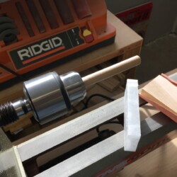 Chamfering and waxing pegs on the lathe