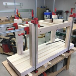 Leg and rail subassemblies glued and clamped, ready for pegs