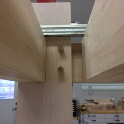 Long rails pegged to legs from the inside
