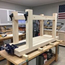 Assembled bench with vise and retractable caster brackets mounted