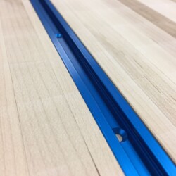 Blue anodized T-track close up