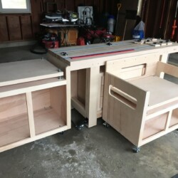 Chop saw and bench saw stands adjacent to the workbench