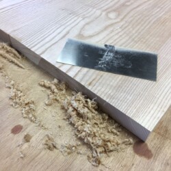 A spring steel card scraper was used to clean up and level the glue joints.