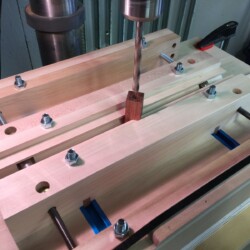 Center drilling a Brazilian Cherry pen blank.