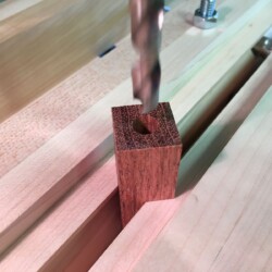 A new 8mm brad point drill bit cuts cleanly using a peck drilling technique to clear chips from deep in the blank.