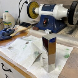 Further polishing and buffing with various grits of buffing compound and cloth wheels