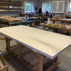 The plywood rolls into the shop in the same orientation from the truck