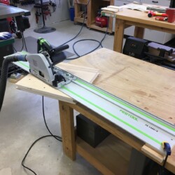 Using my track saw to pad cut the sixty-nine degree angle on the upper carcass sides