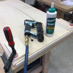 Adding mitered strips to upper and lower panels, to be bullnosed in place on the router table