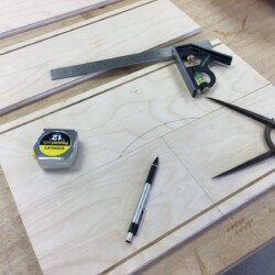 Marking a crescent finger pull on three drawer fronts