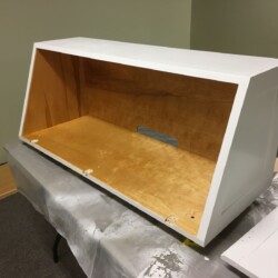 Upper cabinet with semi-gloss urethane on the interior and bright white urethane trim paint on the exterior