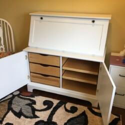 Finished desk, lower cabinet doors open