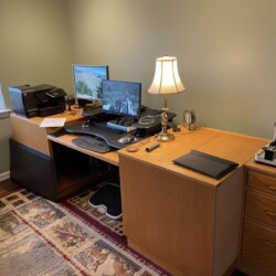 The previous setup with the 36 inch VariDesk convertible standing desk on cabinetry that was made for the home office in Georgia