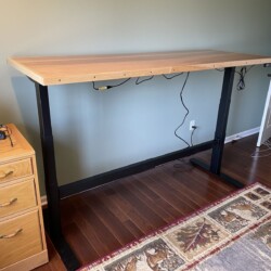 In place at the highest position with the desk top about 48 inches