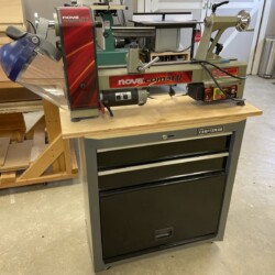 NOVA Comet II midi lathe on its Craftsman roll around cabinet base