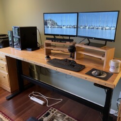 The final arrangement with the monitors on custom risers and the desk in the standing position (wire management not completed yet)