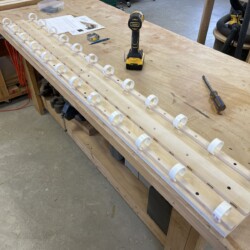 Custom wire management panel will be attached to the back underside of the desk top with screws