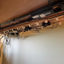 Wires, power strip and power adapters neatly arranged with Velcro