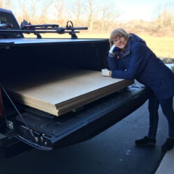 Linda welcoming home the birch plywood that will become her cutting table.