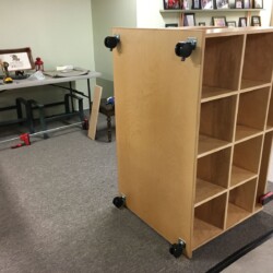 Casters mounted with 1 1/4 screws that penetrate the base and enter into the bottoms of the lower cabinets.
