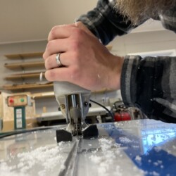 We discovered that a sharp wood cutting blade in the jigsaw cut the 1/2" polycarbonate quickly and left a smooth edge