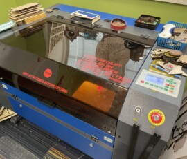 This is the CO2 laser at the Chelsea District Library's Ingenuity Engine maker space that was used to engrave the bamboo plaques