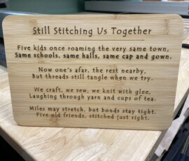 The poem, laser engraved into a bamboo plaque, nee cutting board