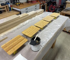 Five plaques lined up for finishing with MinWax water-based, oil-modified polyurethane