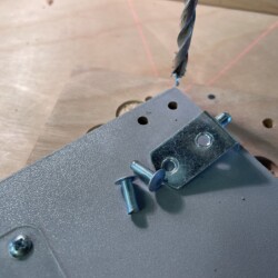 The drilled out rivets would be replaced by small machine screws and Nyloc nuts.
