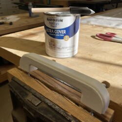 A latex undercoat made the new door and handle ready to accept their final finish.