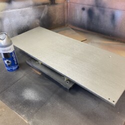 Metallic silver spray paint was the closes approximation of the existing finish on the other play kitchen doors.